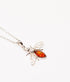Silver bee pendant with amber body on a white background